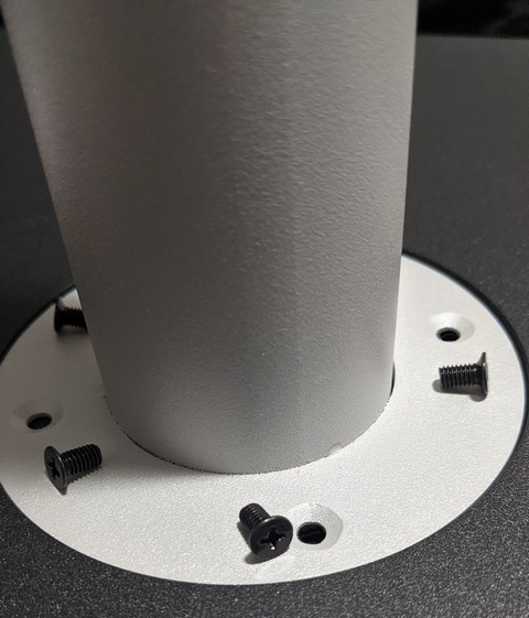Place pole onto base and align holes