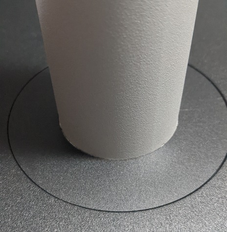 Place adhesive cover over screws